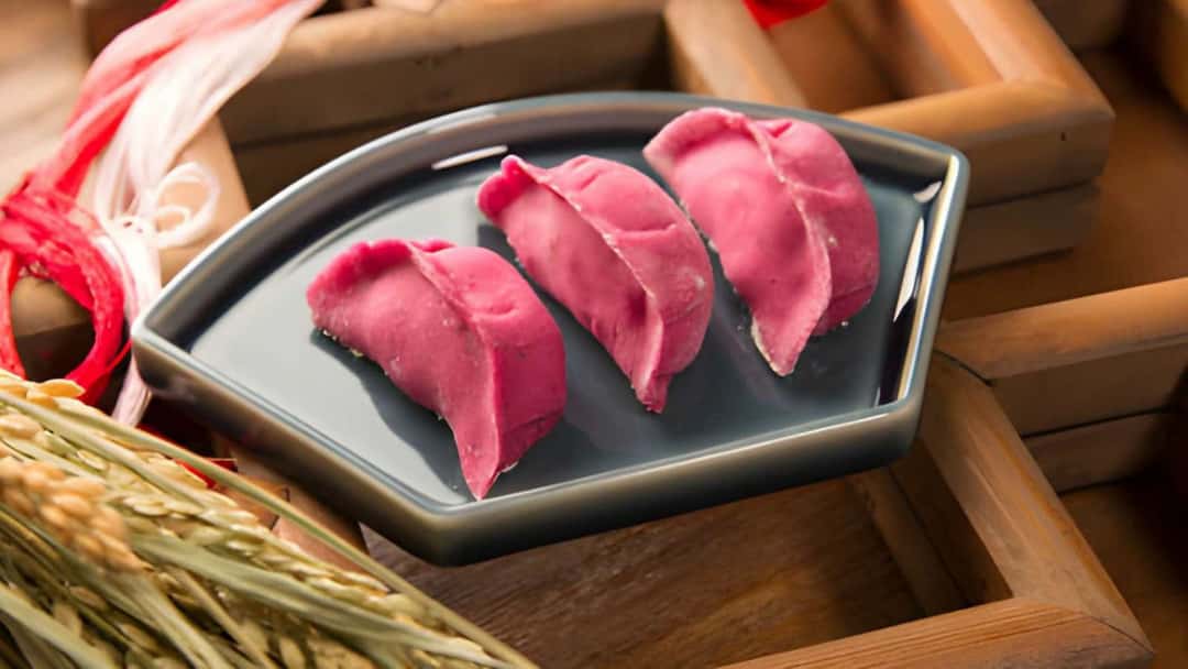 A close-up of beetroot-stuffed momos