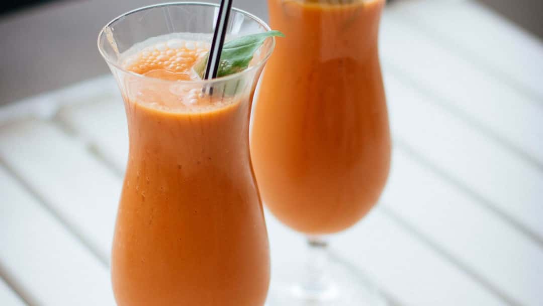 Creamy carrot milk served in elegant glasses