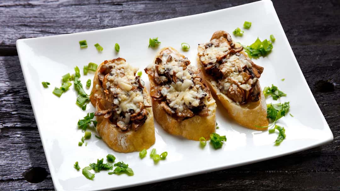 Mushroom bruschetta on a plate - banner image