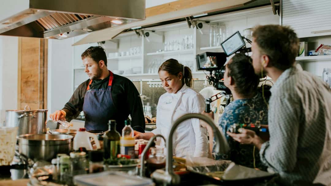 People recording a chef