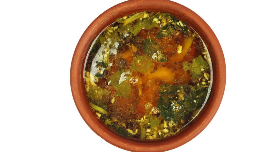 Top view of gongura rasam in a bowl. (banner image)
