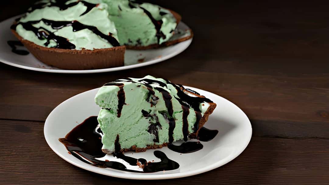 A slice of grasshopper ice cream pie on a plate