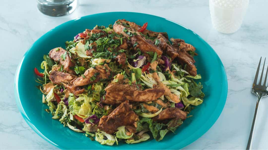 A plate of grilled chicken cabbage salad 