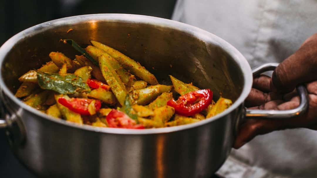 Guvar dhokli nu shaak in a pot. (banner image)