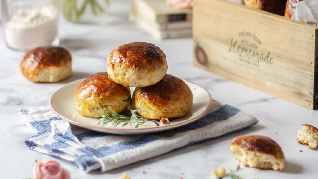 Buttery khapli wheat scones on a plate. (banner image)