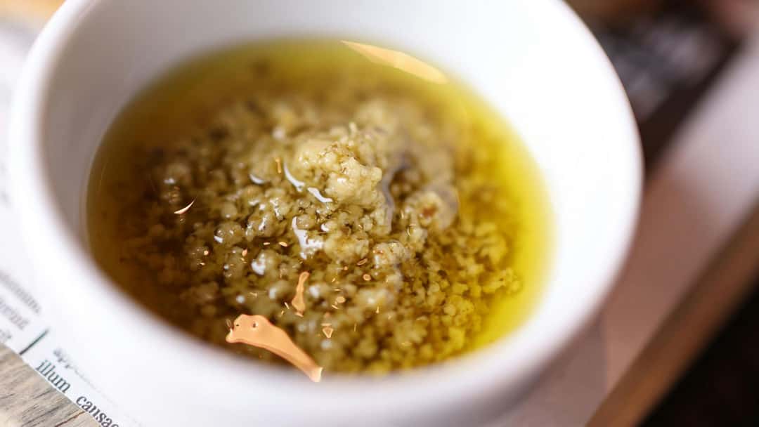 Italian recipes bagna cauda in a bowl. (banner image)