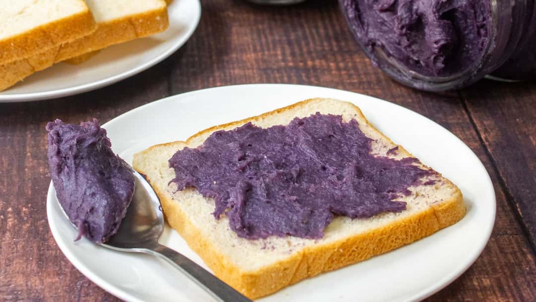 Top view of jamun butter spread on bread slices. (banner image)