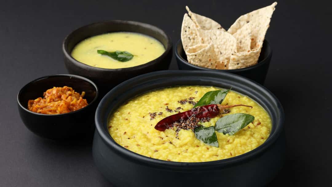 Kairichi Dal with papad and kadhi.