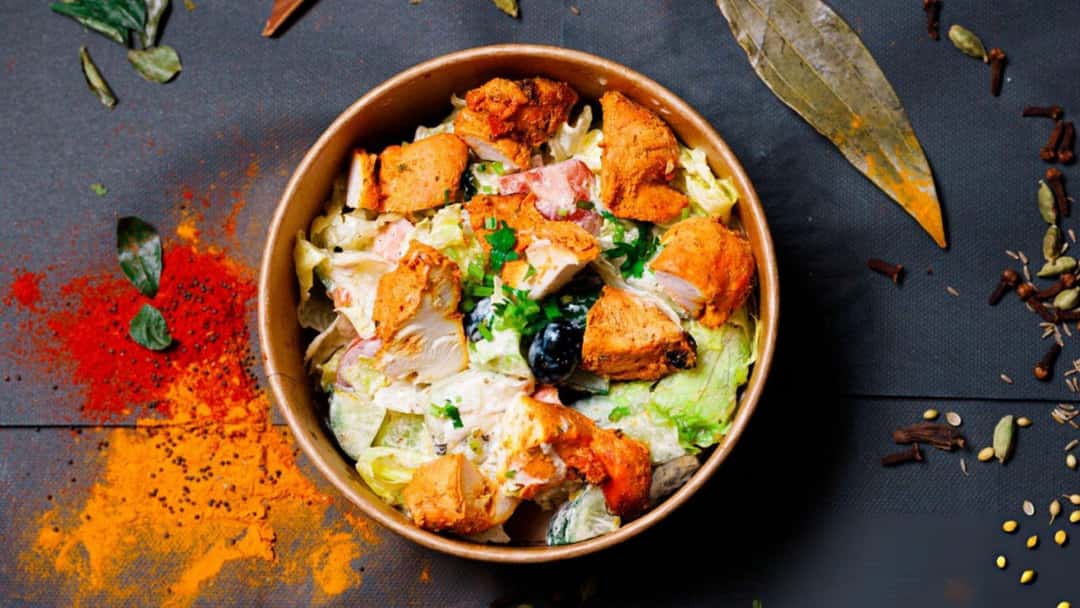 Top view of a keto chicken tikka bowl