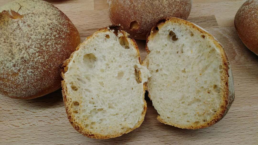 Sliced buttermilk khapli wheat bread buns. (banner image)