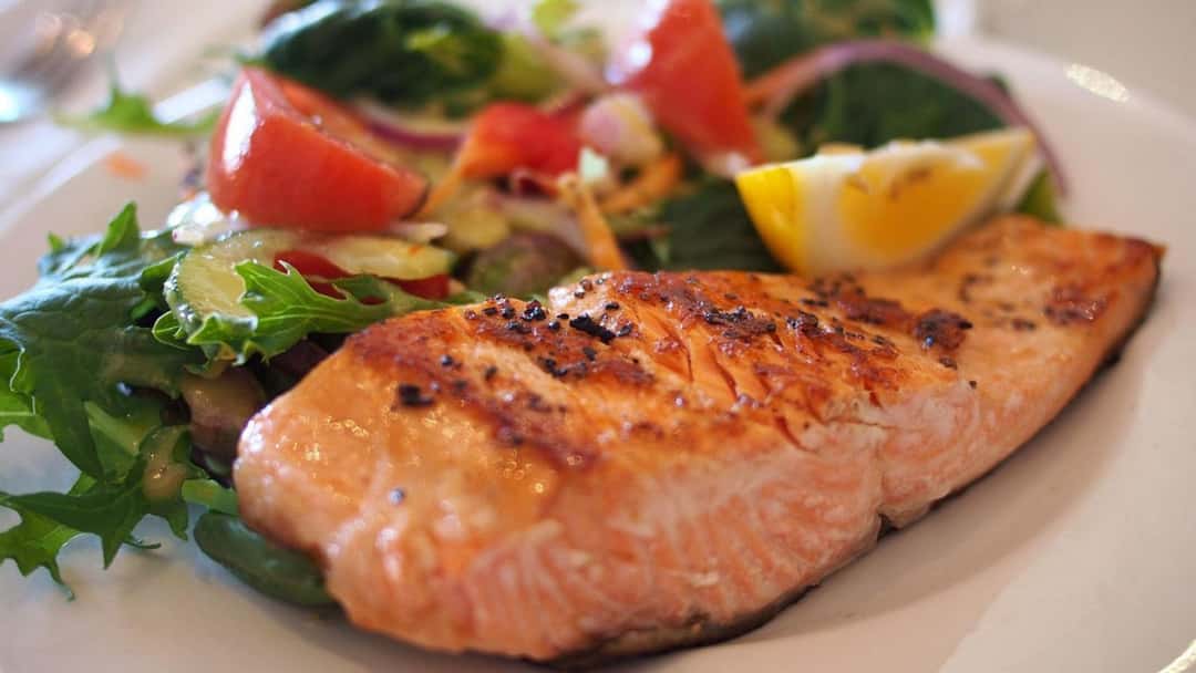 Lemon-herb grilled fish fillet on a plate