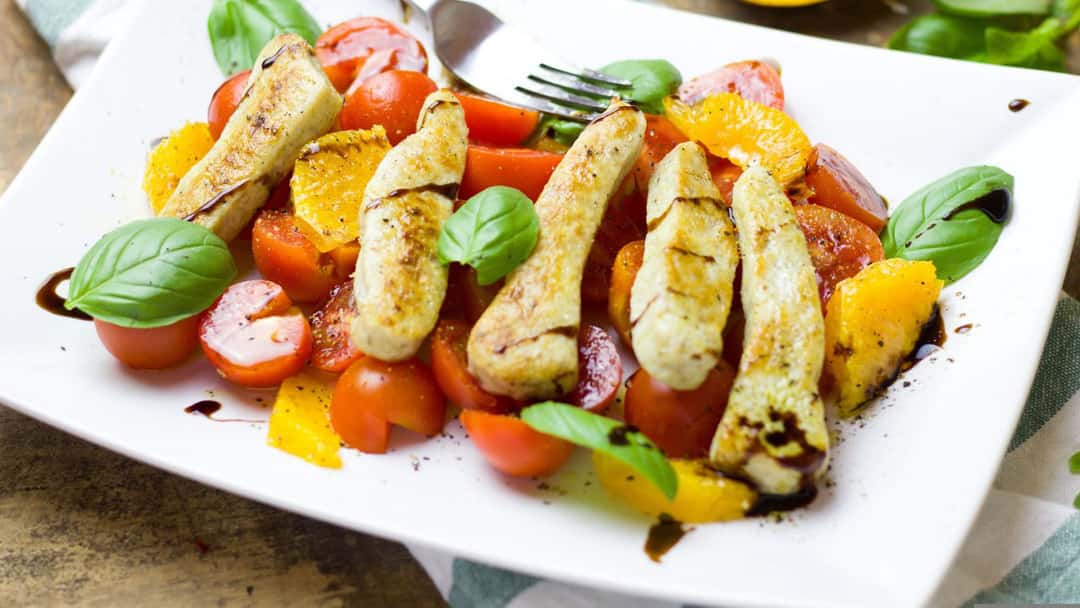 A plate of mango chicken salad 
