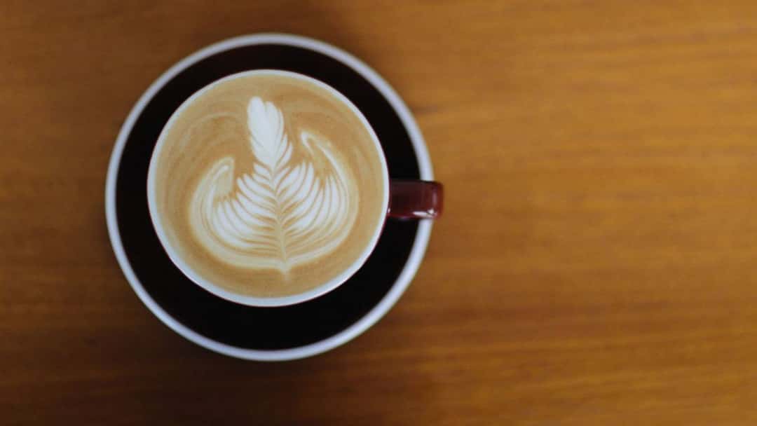 Latte art on coffee in a cup - banner image