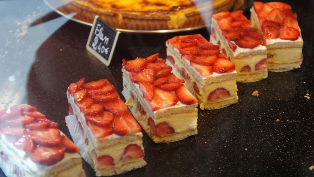 Top view of a line of strawberry cheesecake bars