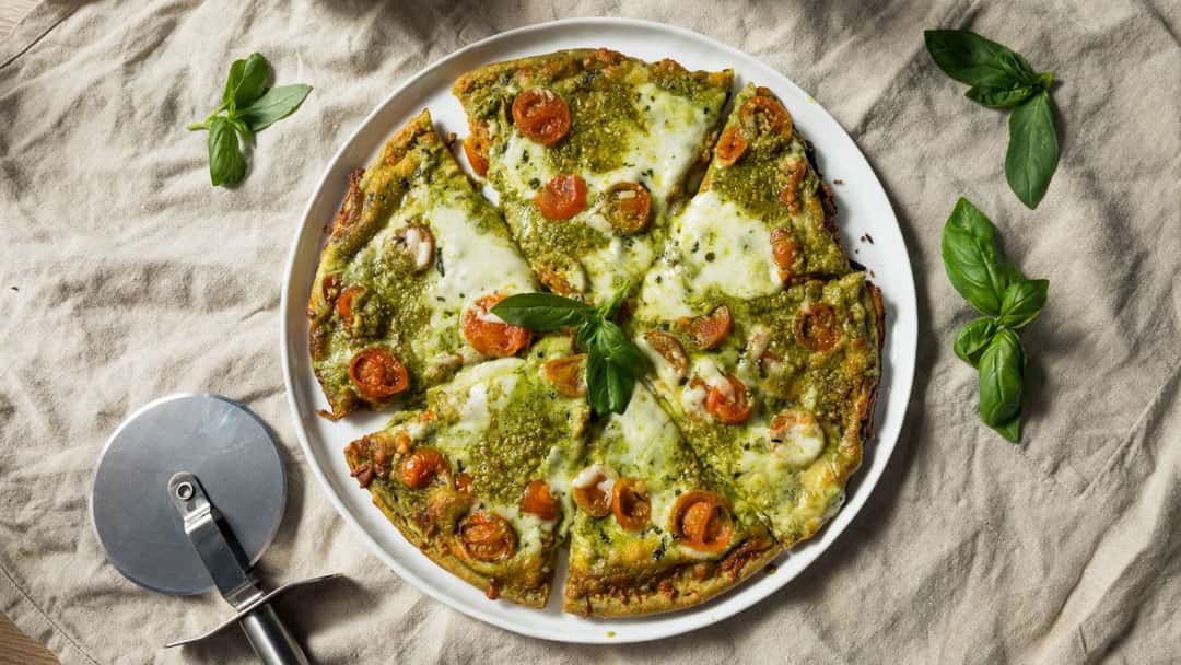 Pesto Ricotta Pizza on a white plate