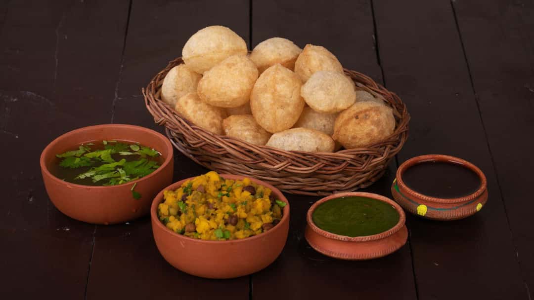Rice paper pani puri with sides on a plate. (banner image)