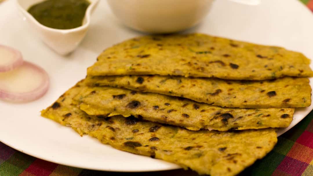 Sabud moong palak theplas on a plate
