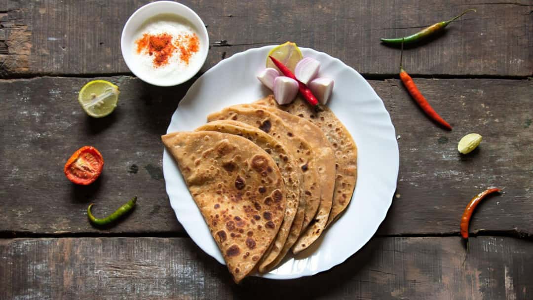 Soft parathas on a plate