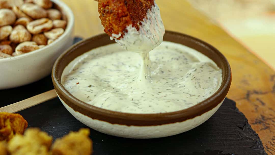 Creamy spicy ranch sauce in a bowl