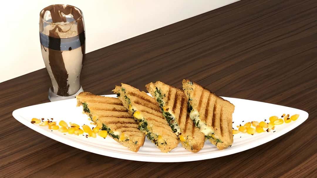 Spinach corn sandwiches on a serving platter