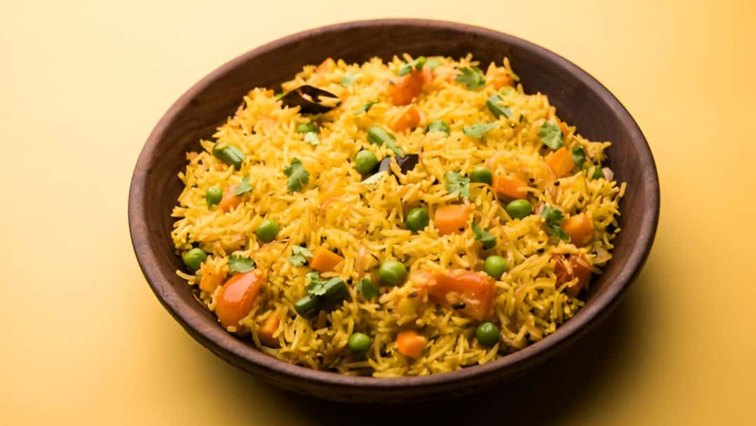 Vegetable Pulao in a wide wooden bowl
