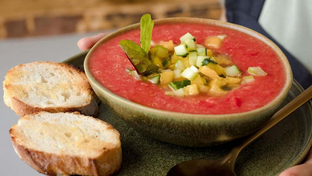 Watermelon gazpacho in a wooden bowl