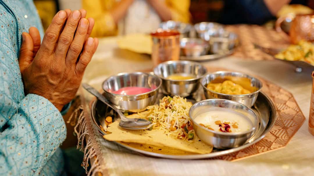 Person with a simple thali