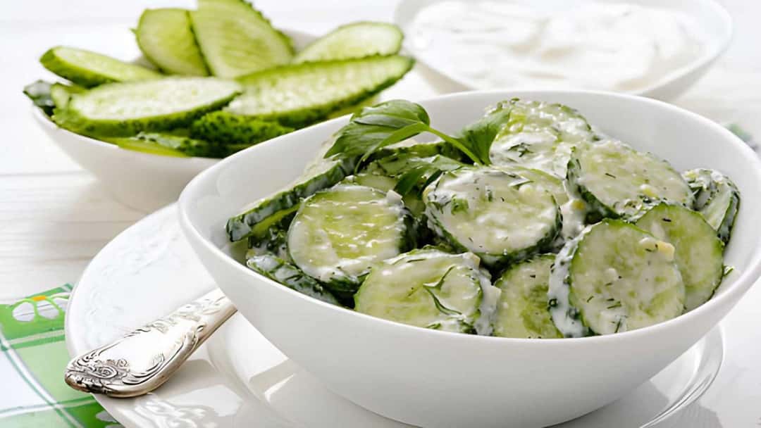 Cucumber curd salad garnished with spices and herbs