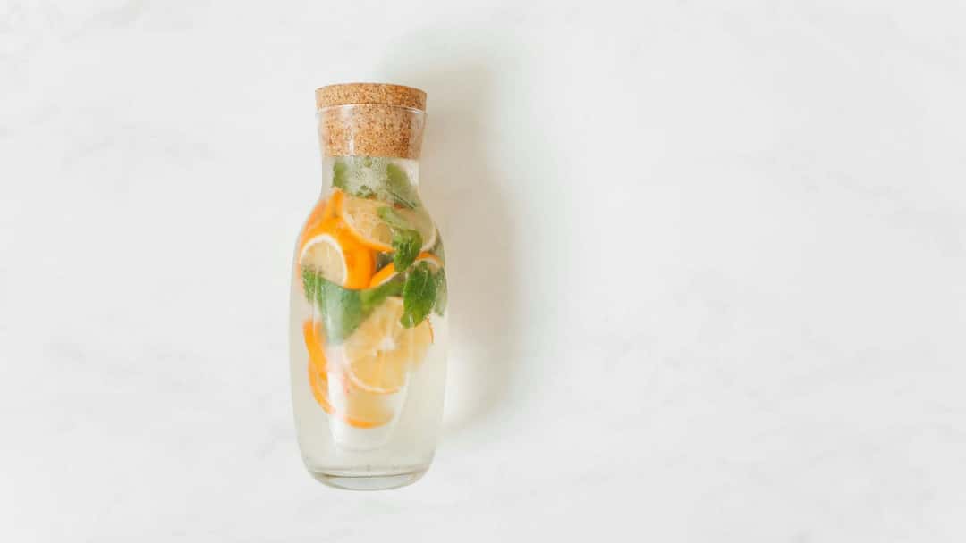 Glass bottle with orange slices