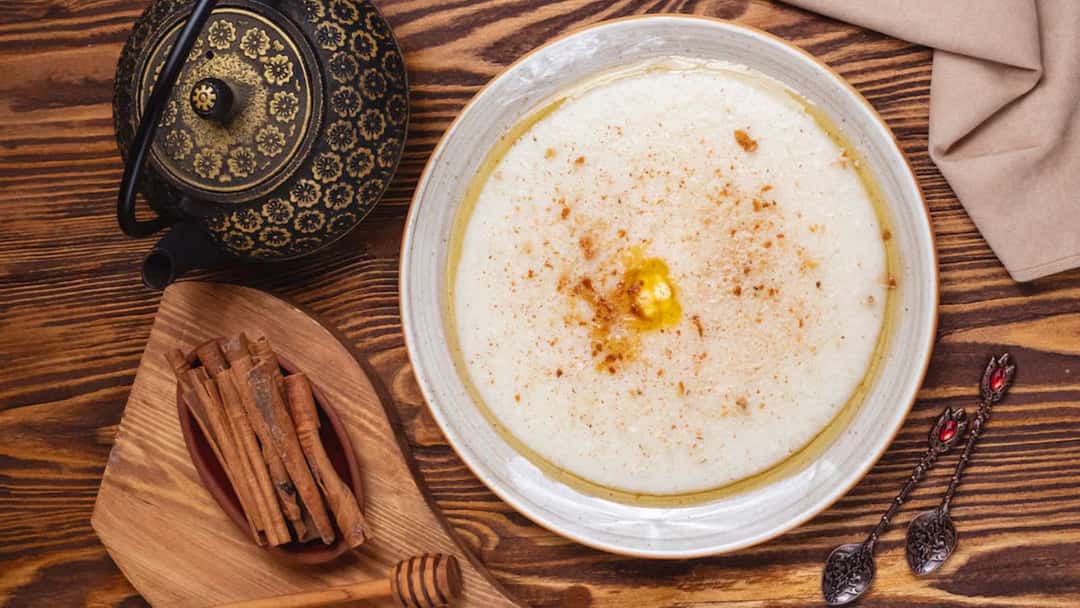 Traditional Middle Eastern sahlab topped with nuts, coconut and cinnamon