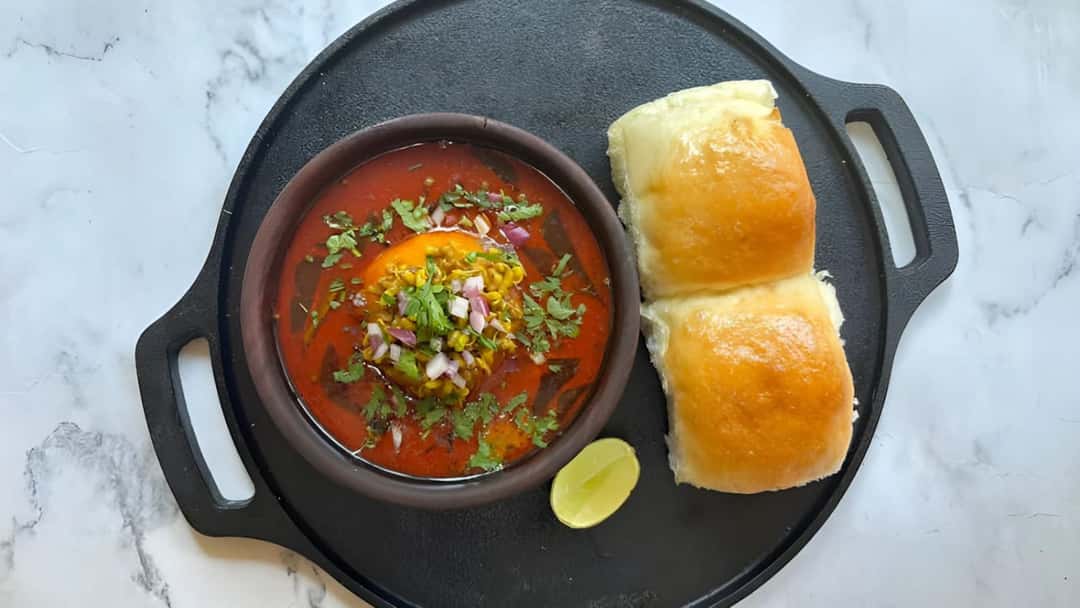 Misal pav on a black plate