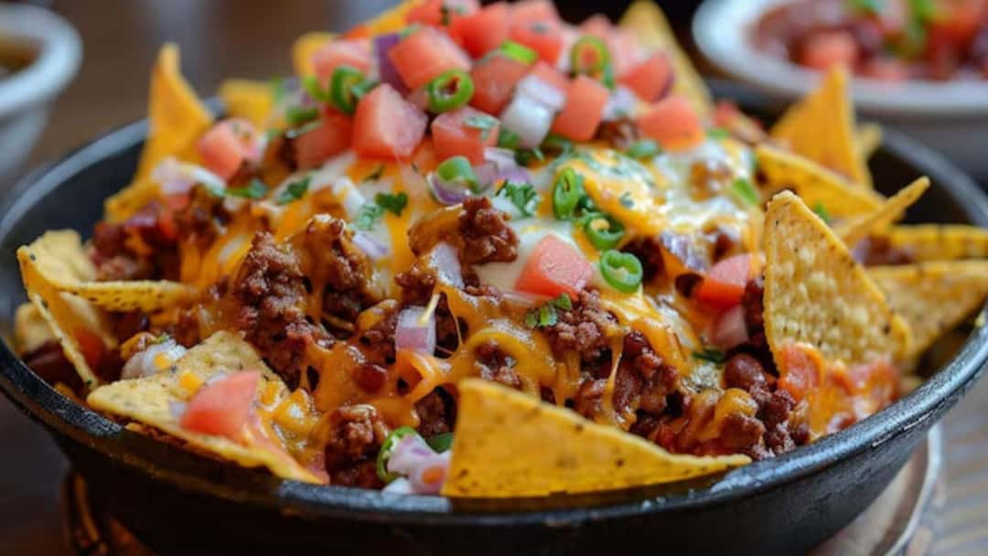 Spanish nachos topped with olives, cheese and peppers