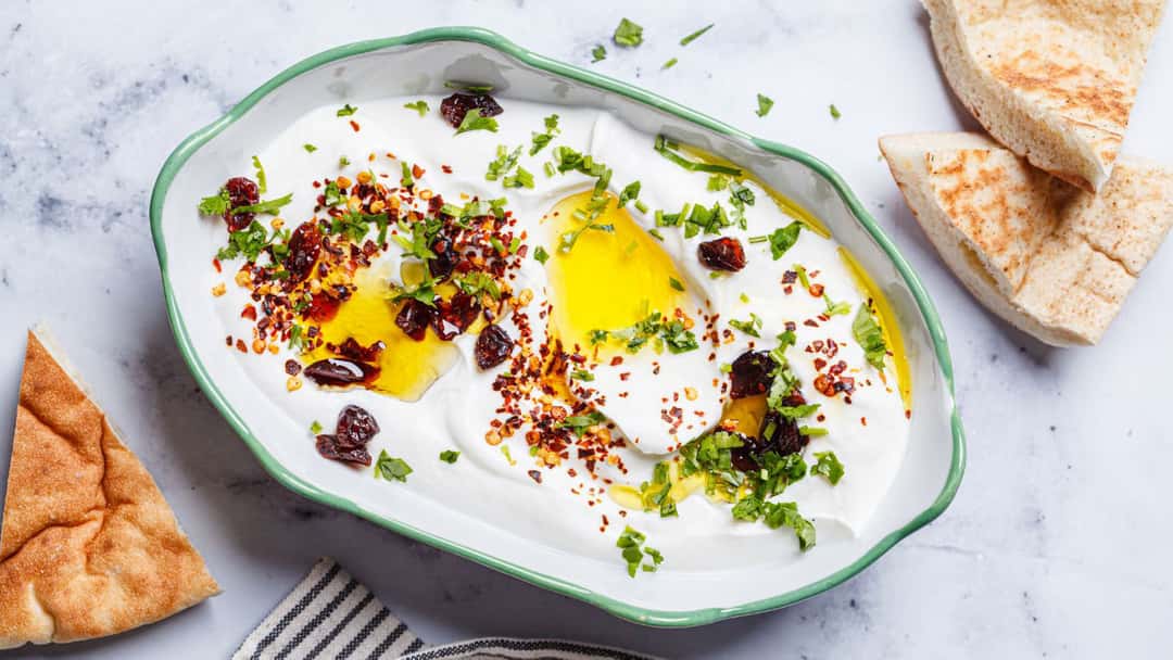 Top view of whipped feta dip in a bowl. (banner image)