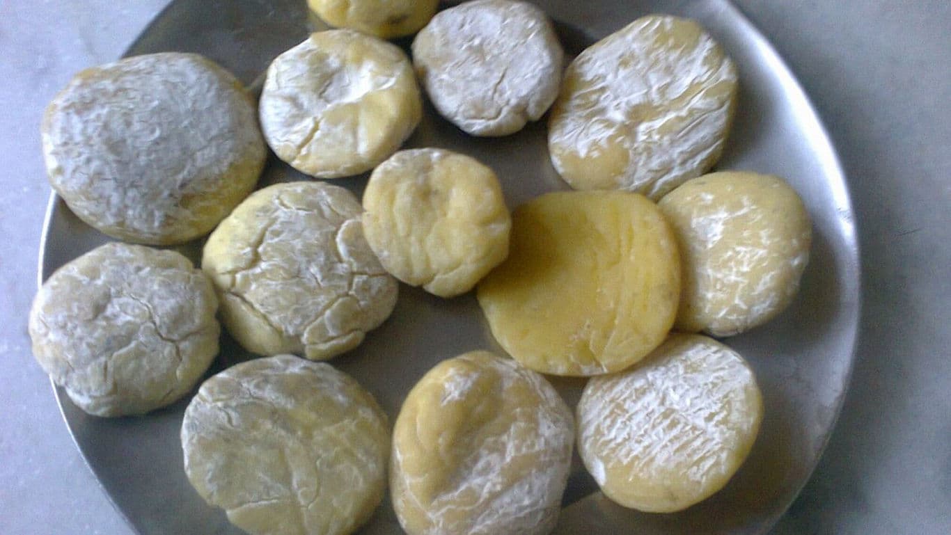 Homemade Dough Discs Arranged on Metal Plate