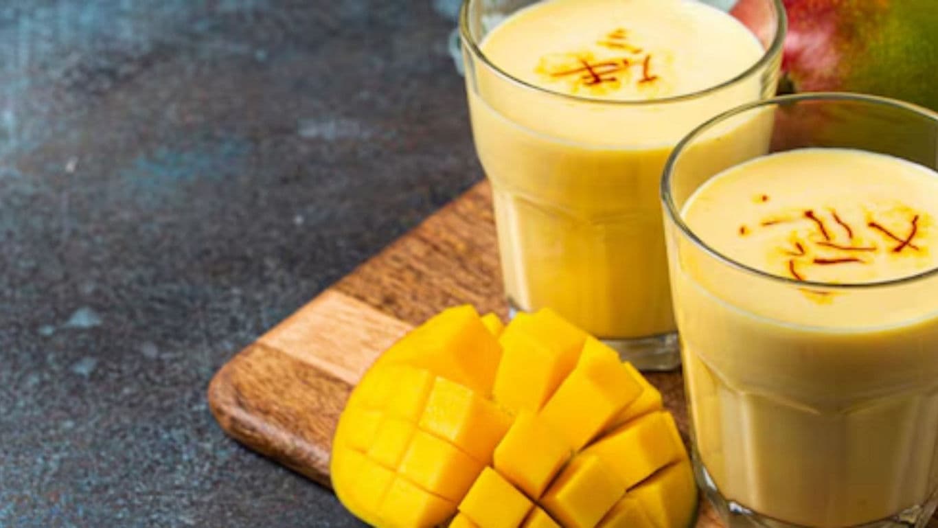 Fresh mango smoothie drinks with saffron garnish