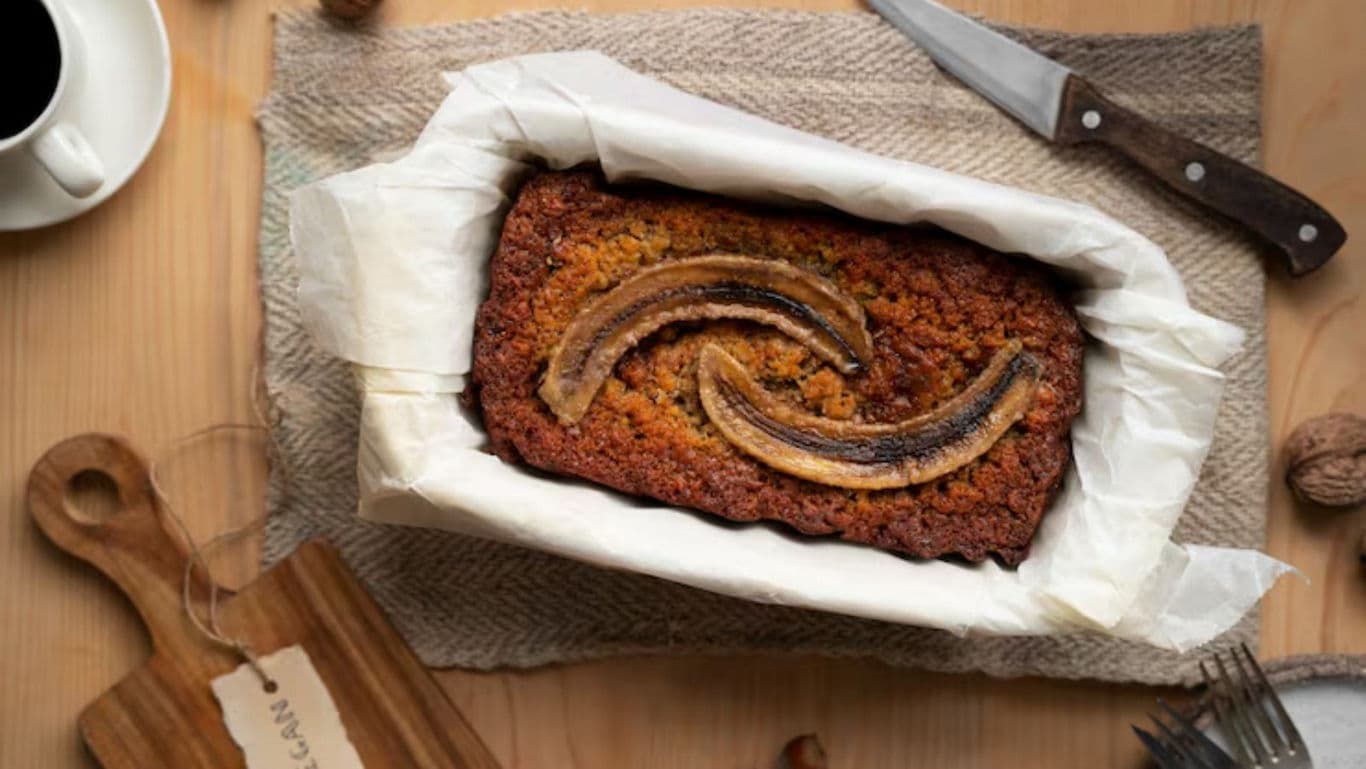 Homemade banana bread on rustic table