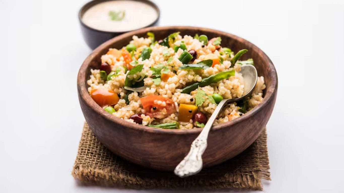 Colorful vegetable millet salad in wooden bowl