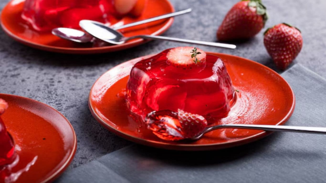 Strawberry jelly dessert served on red plates