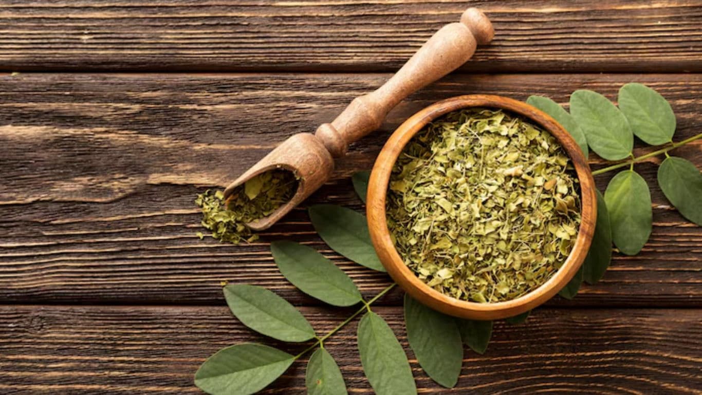 Dried Green Leaves in Wooden Bowl on Table