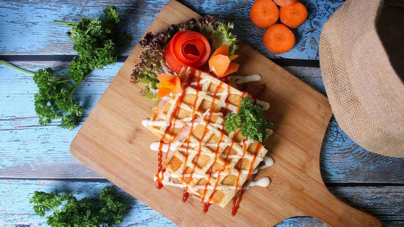 Gourmet waffle with vegetables on board