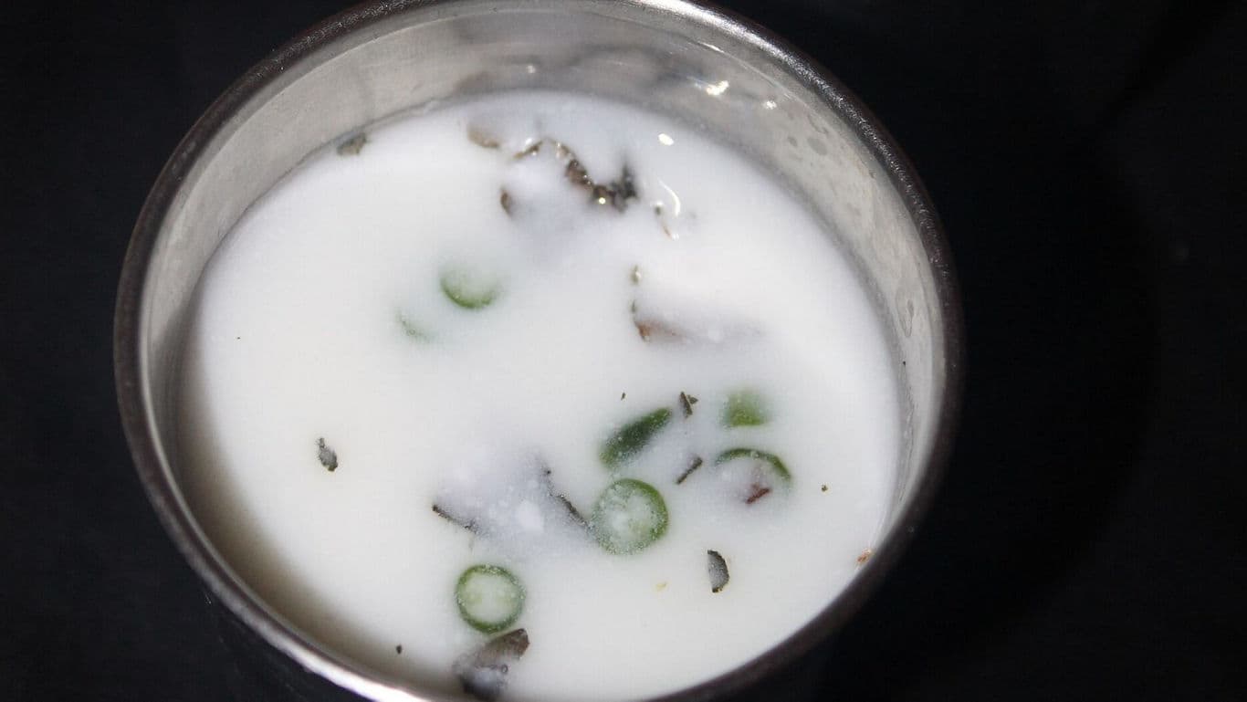 Spiced buttermilk drink in metal cup