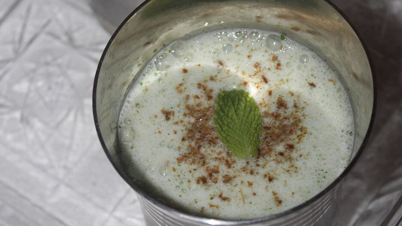 Chilled Spiced Buttermilk Drink with Mint Leaf Garnish