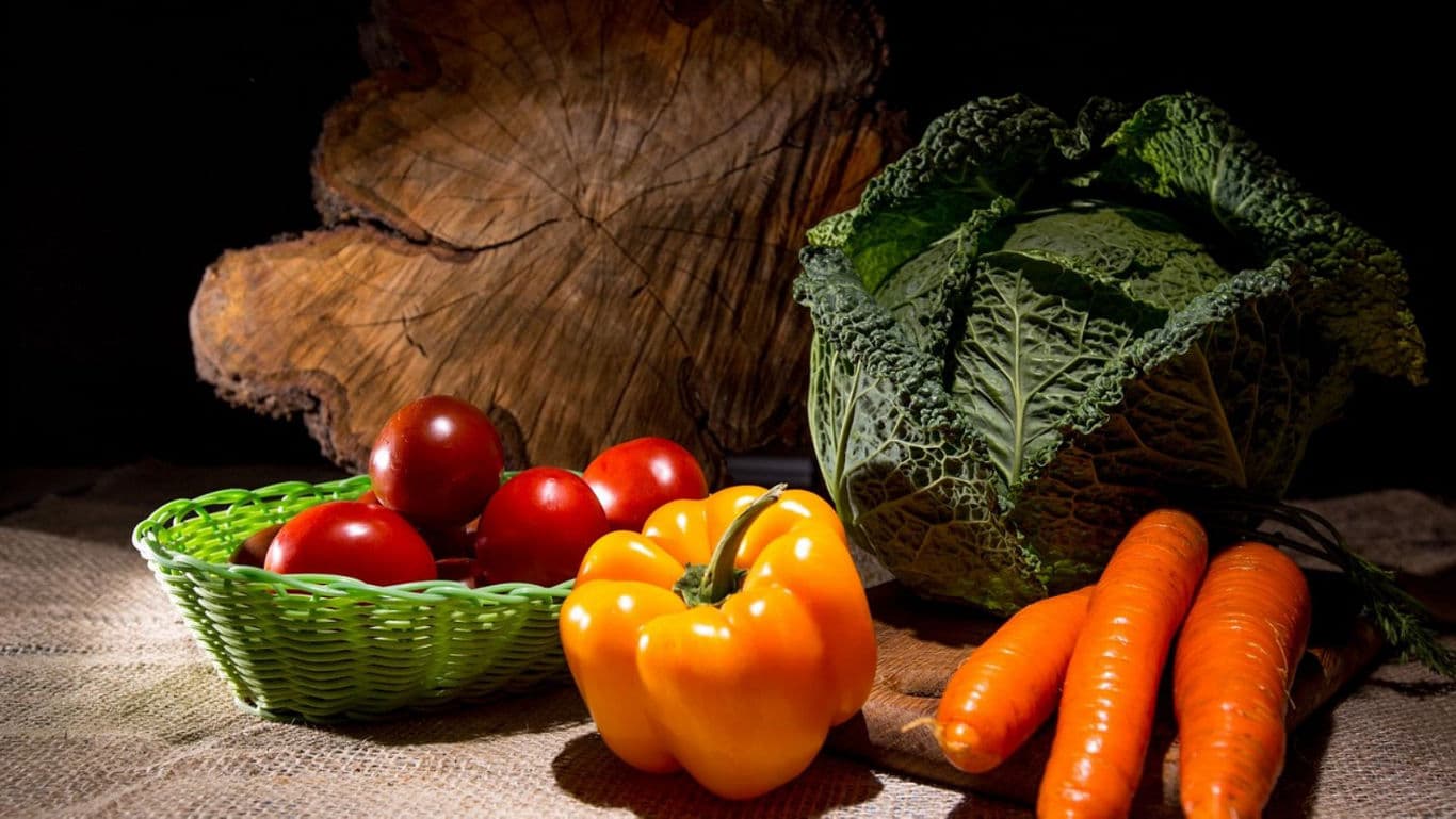 Fresh vegetables with cabbage, tomatoes, and carrots
