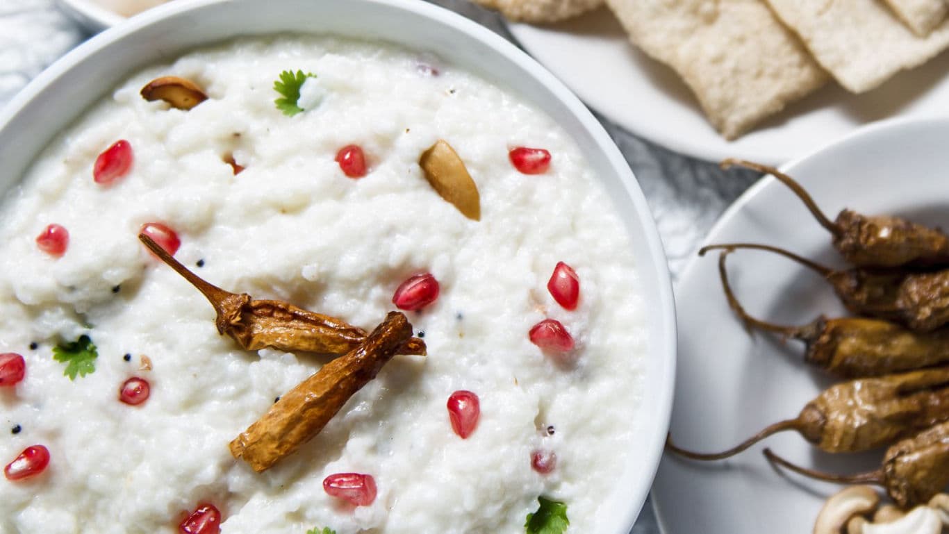 Curd rice with pomegranate and sides