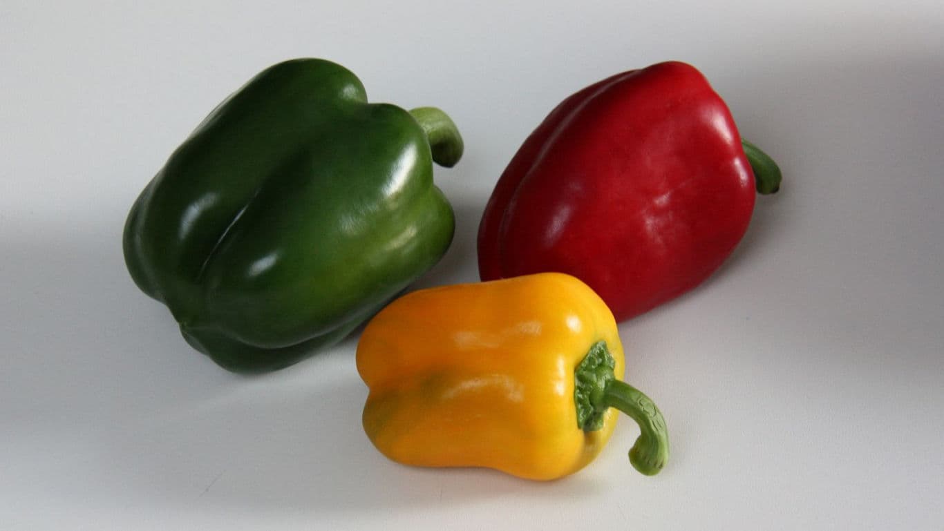 Green red and yellow bell peppers