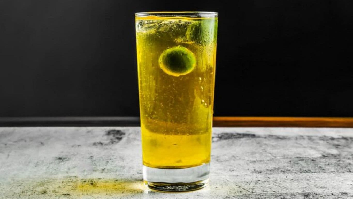 Tall glass of yellow citrus drink