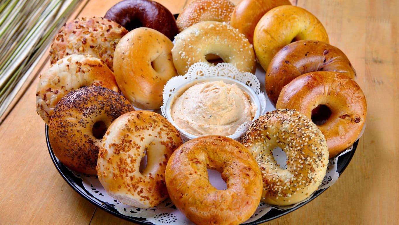 Assorted fresh bagels with creamy dip