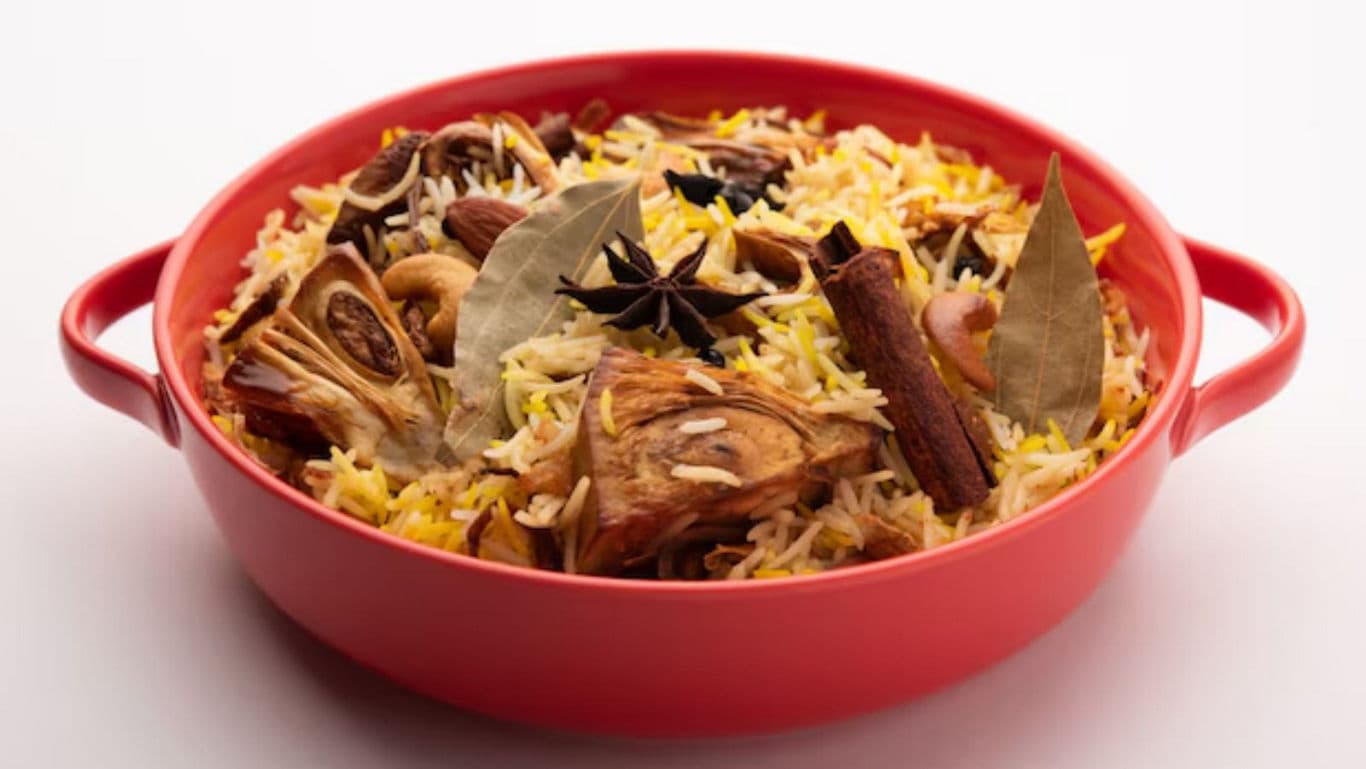 Jackfruit biryani served in red casserole dish