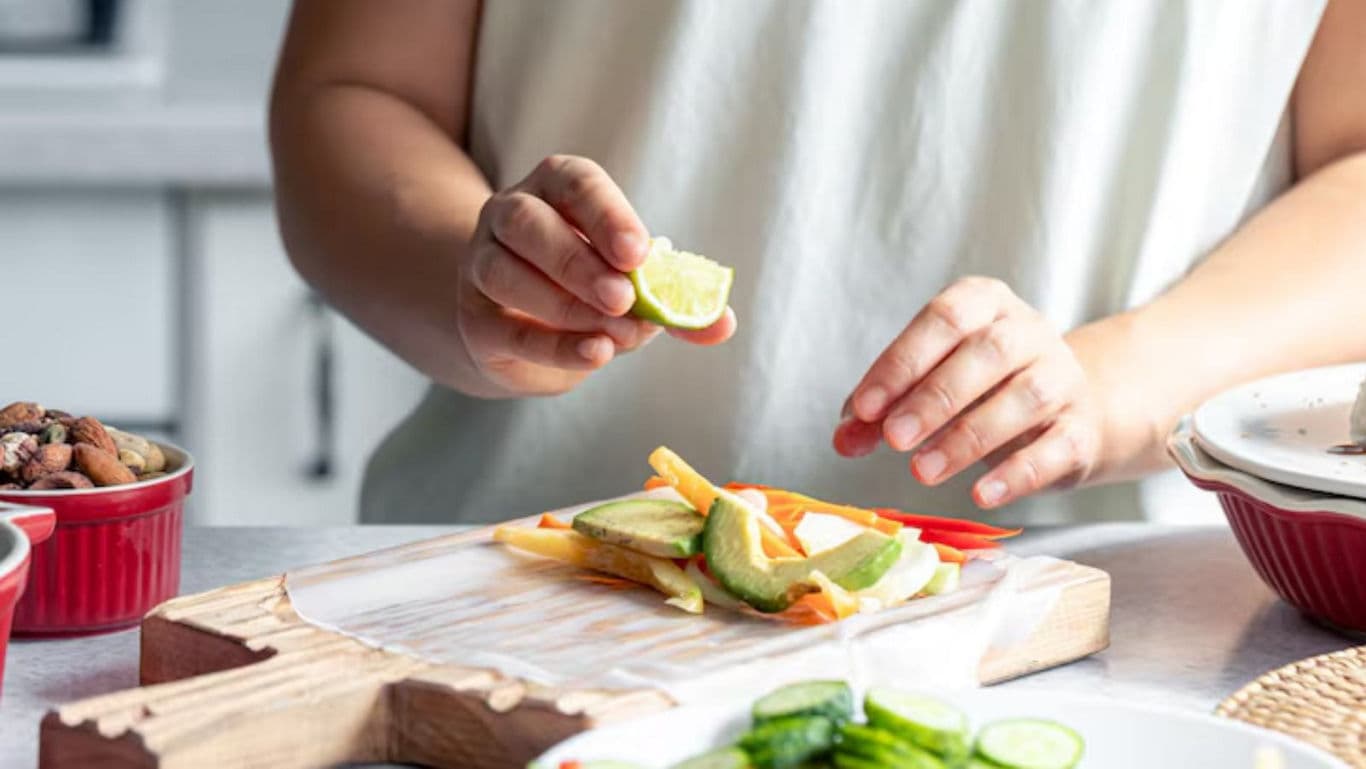 Person Preparing Fresh Vegetable Snack in Kitchen