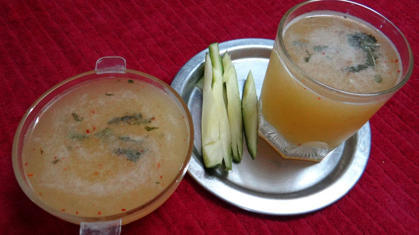 Refreshing homemade fruit drink with slices